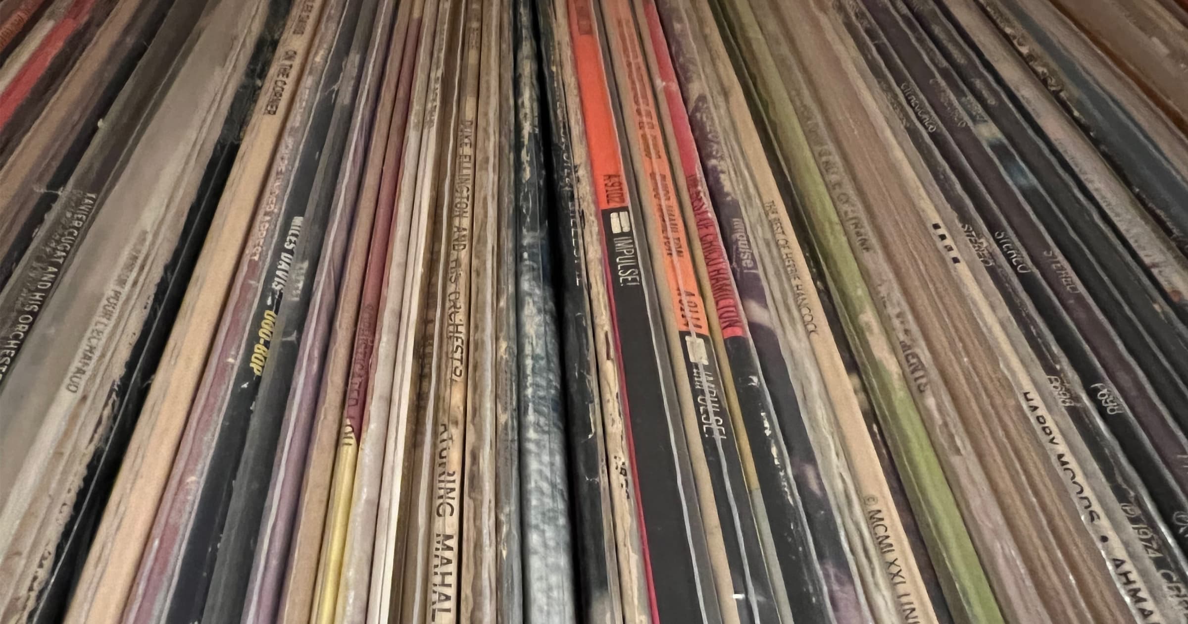 view of phonograph records on a shelf at an angle